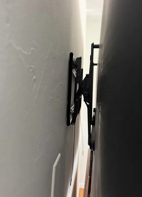 TV wall bracket installed level on a living room wall