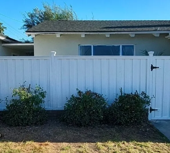 White privacy fence and landscaping at a St. Pete home